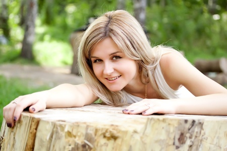 Young cute girl resting in fresh spring grassの写真素材
