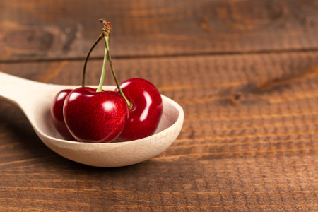 Cherries on wooden tableの写真素材