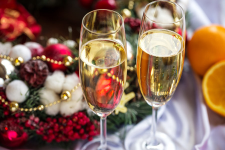 Two champagne glass on christmas backgroundの写真素材