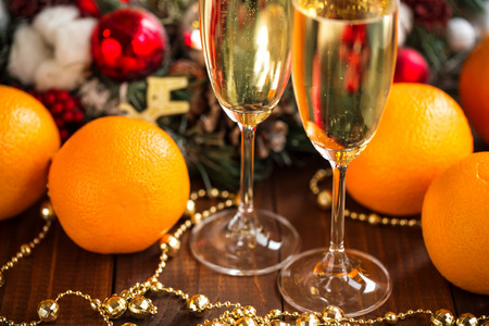 Two champagne glass on christmas backgroundの写真素材