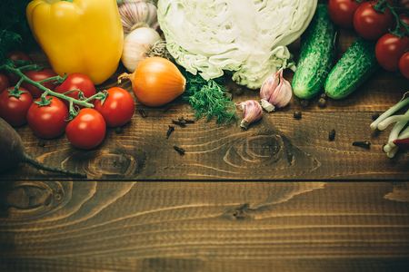 different vegetables on the old brown boards with free spaceの写真素材