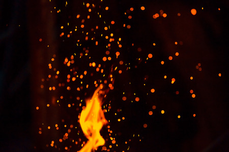 Christmas Glitter Lights Defocused Background. Sparks from the flame