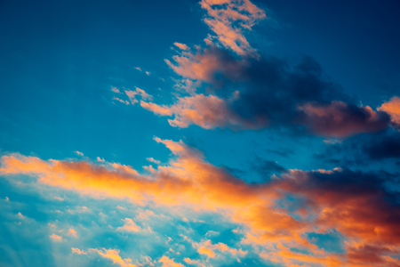 Beautiful blazing sunset landscape at over the meadow and orange sky above it. Amazing summer...