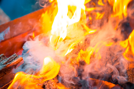 Beautiful burning fire flame background with smokeの写真素材