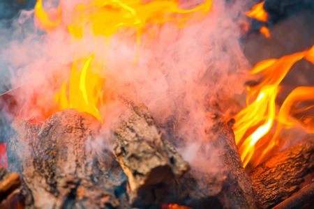 Beautiful burning fire flame background with smokeの写真素材