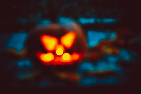 Halloween night blurred background with pumpkin. Soft focus. shallow DOFの写真素材