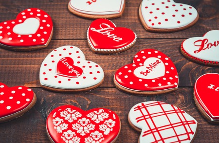 Heart-shaped biscuits for Valentine's Day. Gingerbread Valentine on wooden backgroundの写真素材