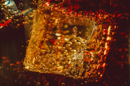 Beautiful cola with ice cubes close up in glass. Shallow DOF.の写真素材