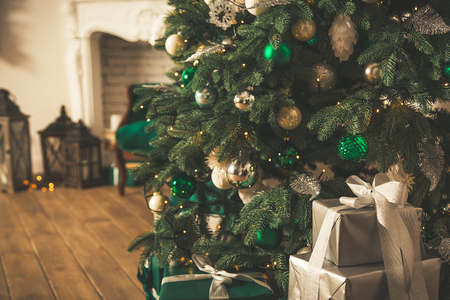 Christmas tree with gifts in Christmas living room. Beautiful New Year decorated classic home interior. Winter backgroundの写真素材