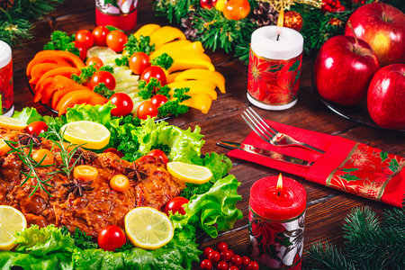 Christmas table dinner time with roasted meats, candles and New Year dÃ©cor. Background thanksgiving. The concept of a family holiday, Beautiful delicious foodの写真素材