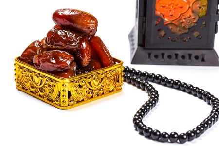 The Muslim feast of the holy month of Ramadan Kareem. Beautiful background with a shining lantern...