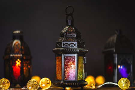 The Muslim feast of the holy month of Ramadan Kareem. Beautiful background with a shining lantern...