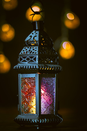 The Muslim feast of the holy month of Ramadan Kareem. Beautiful background with a shining lantern...