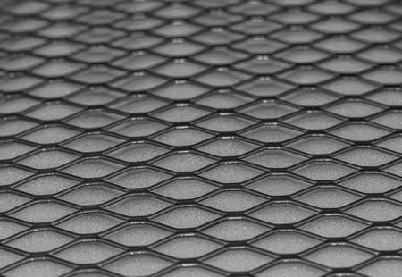 Metal grid with geometric pattern of rhombi, background. Black metallic modern backgroundの写真素材