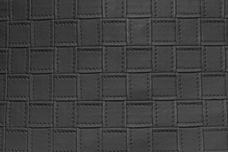 Black background, abstract background of intertwined leatherの写真素材