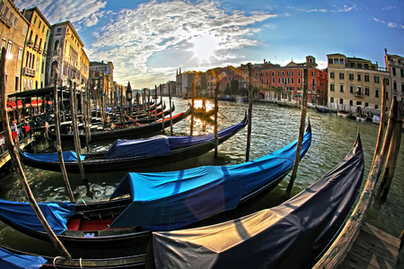 Beautiful sunset with gondolas in Veniceの写真素材