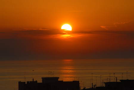 Beautiful Sunset Over the City in Gallipoli above the seaの写真素材