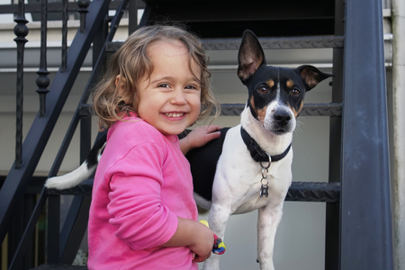 Little cute girl and Jack Russel dogの写真素材