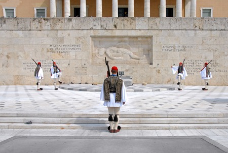 The Changing of the Guards in Athens four marching and one man back view ,Greece.のeditorial素材