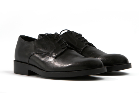 Male black shoes on a white background isolatedの写真素材