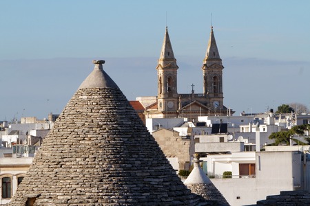 Panoramic view of Alberobello with Tetto di Trullo and church of Saints Cosimo and Damianoの写真素材