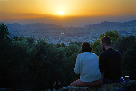 ATHENS - GREECE - OCTOBER 07 2018 Admiring the sunset over the city together after a day of walking aroundのeditorial素材