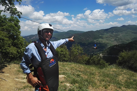 ITALY, CASTELMEZZANO , ANGEL FLIGHT- 14 MAY 2017, woman in a helmet and a suit before the Angel flight points toのeditorial素材