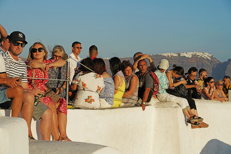 OIA, GREECE, 19 September 2018 Tourists waiting to take pictures of the sunset in Santorini, Cycladesのeditorial素材