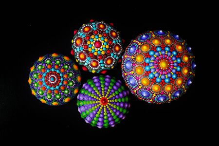 Beautiful mandala rocks on black background