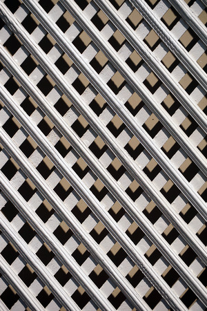 A white painted wooden railing creates an interesting graphic compositionの写真素材