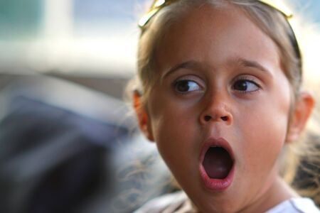 Portrait of a 4 year old girl yawning from fatigueの写真素材
