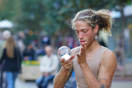 Sofia, Bulgaria October, 27, 2019 Street artist does his show with a ball on Boulevard Vitoshaのeditorial素材