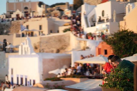 SANTORINI, GREECE, SEPTEMBER 20 2018 Tourists from all over the world waiting for the sunset in Oiaのeditorial素材