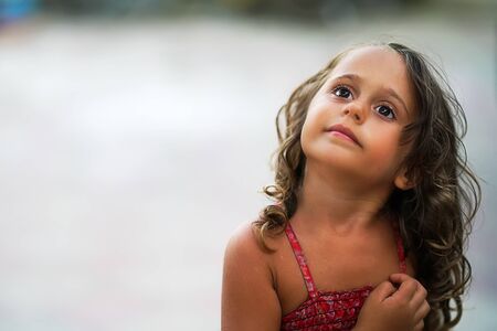 Cute little girl looking with copy space