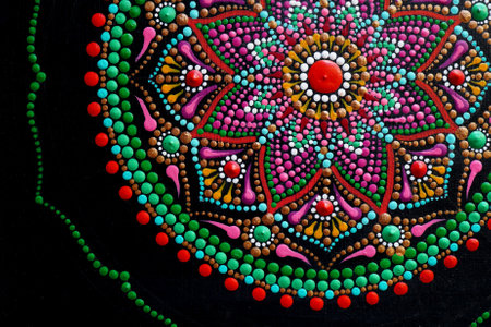 Beautiful hand painted mandala on black backgroundの写真素材