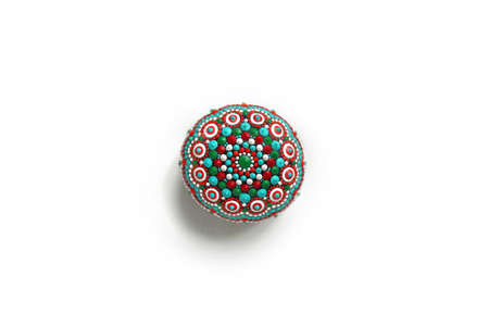 Beautiful colorful hand painted dot mandala on gray background, isolated
