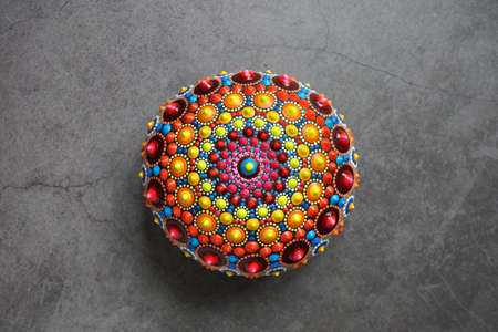 Beautiful colorful hand painted dot mandala on white background, isolatedの写真素材
