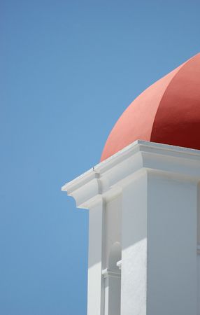The roof of a small building at Castillo El Morro in San Juan, Puerto Rico contrasts with a pure blue Caribbean skyの写真素材