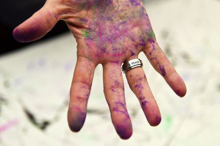 Peace Text on Ring Finger of Art Covered Handの写真素材