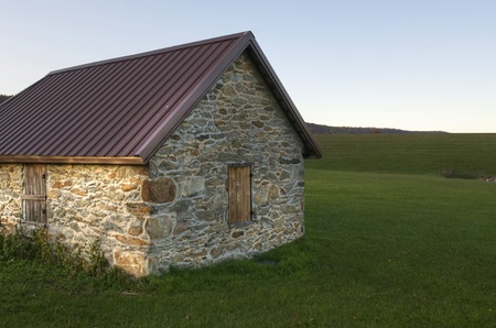 An old stone building surrounded by greenの写真素材