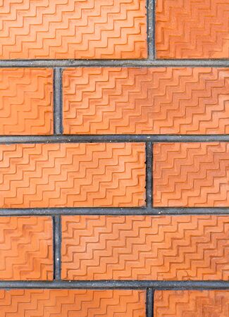 Close up weathered red brick wall texture for background. Vertical photography.の写真素材