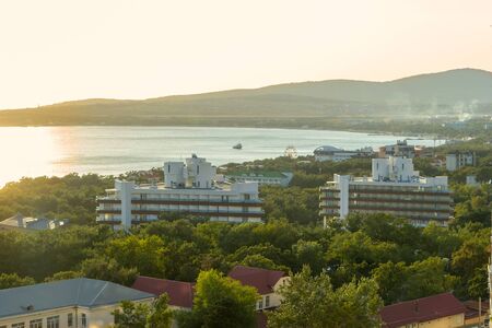 Solar seaside of Gelendzhik on sunset. View from hotel balcony. Warm vacation background.の写真素材