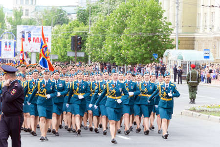 DONETSK, Donetsk People Republic, May 9, 2018. Women from the Ministry of Emergencies in full dress march along the main street of the city during the parade in honor of Victory Day in World War IIのeditorial素材