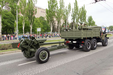 Donetsk, Donetsk Peoples Republic, Ukraine, May 9, 2018. A convoy of military vehicles with artillery guns on a trailer moves along Artyom Street during the Victory Day parade in World War IIのeditorial素材