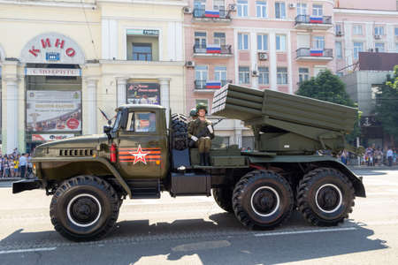 Donetsk, Donetsk People Republic, Ukraine - June 24, 2020: A column of Soviet multiple launch rocket systems Grad moves along Artyoma Street during the Victory Day parade in World War II.のeditorial素材
