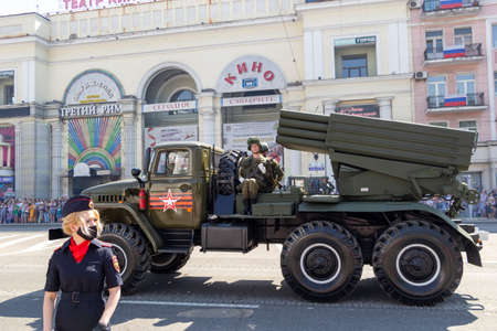Donetsk, Donetsk People Republic, Ukraine - June 24, 2020: A column of Soviet multiple launch rocket systems Grad moves along Artyoma Street during the Victory Day parade in World War II.のeditorial素材