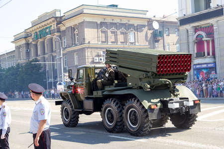 Donetsk, Donetsk People Republic, Ukraine - June 24, 2020: A column of Soviet multiple launch rocket systems Grad moves along Artyoma Street during the Victory Day parade in World War II.のeditorial素材