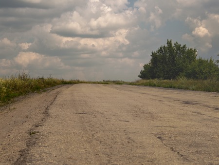 The asphalted road leaves up.の写真素材