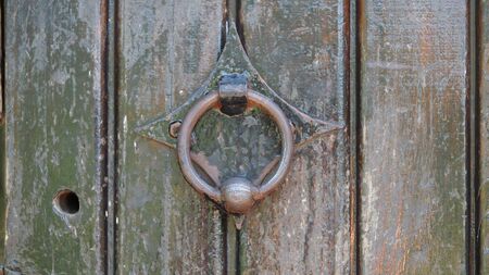 old metal handle on a wooden doorの写真素材