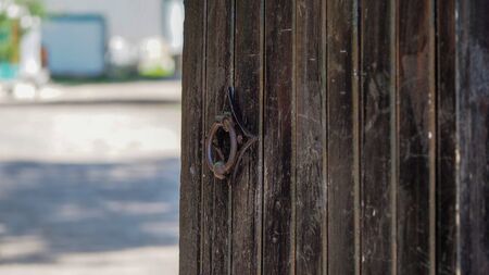 old metal handle on a wooden doorの写真素材